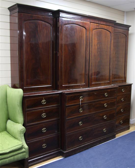 A 19th century mahogany and boxwood line inlaid breakfront bookcase, W.8ft 2in. H.7ft 5.5in. D.2ft